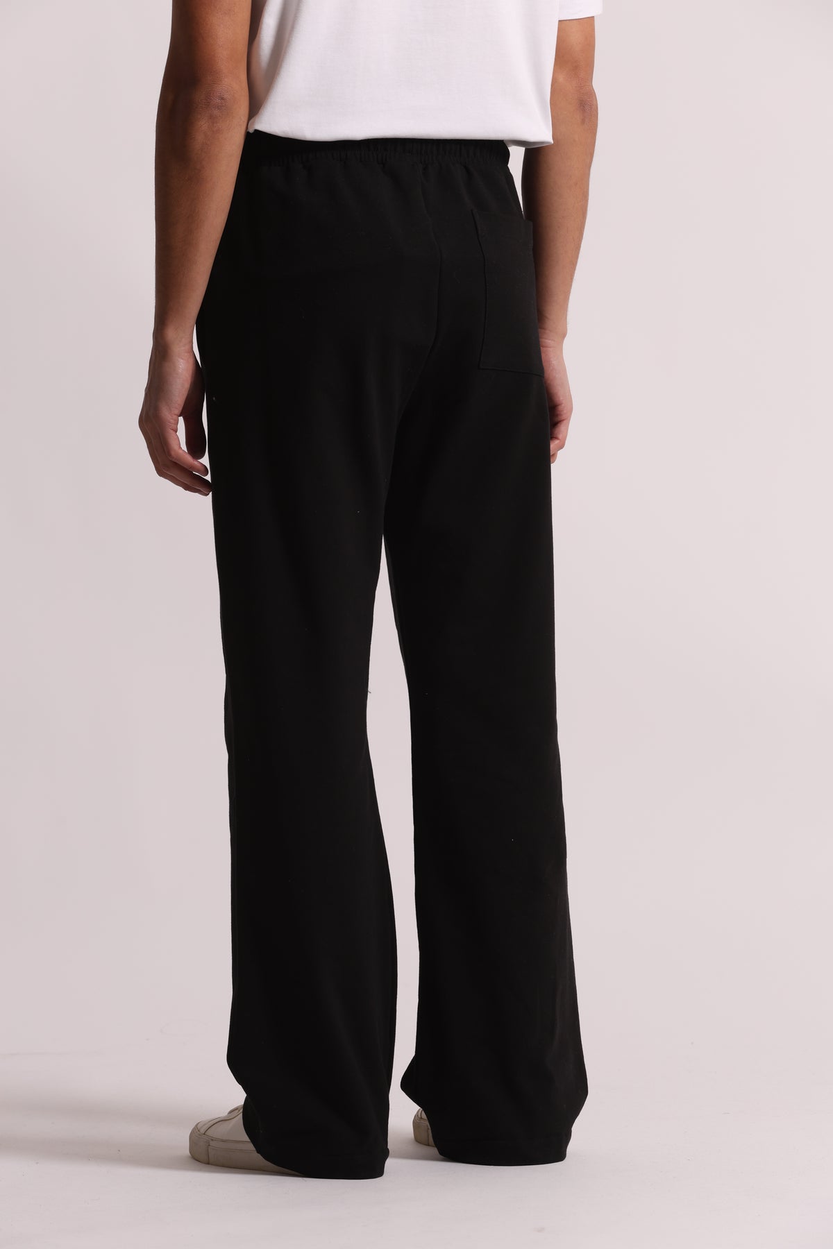 PANTALONI TUTA A GAMBA LARGA