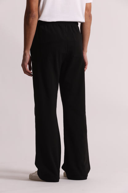 PANTALONI TUTA A GAMBA LARGA